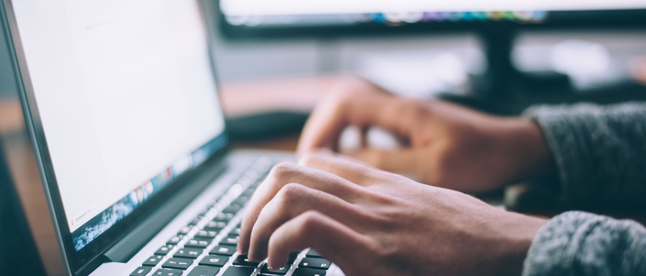 Person typing on laptop